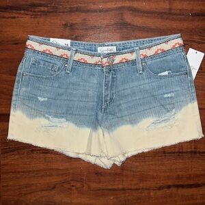 Distressed denim and bleached shorts. Size 25